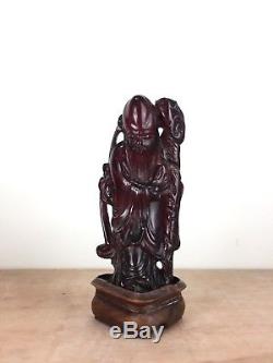 Antique CHERRY AMBER BAKELITE TYPE CARVED CHINESE FIGURE on stand