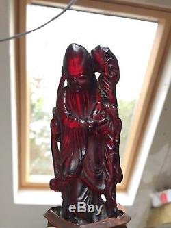 Antique CHERRY AMBER BAKELITE TYPE CARVED CHINESE FIGURE on stand