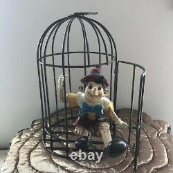 Pinocchio in Metal bird cage Resin Statue Figure