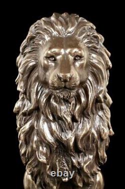 Sitting Lions Figure on Black Monolith Veronese Bronze-Look Statue
